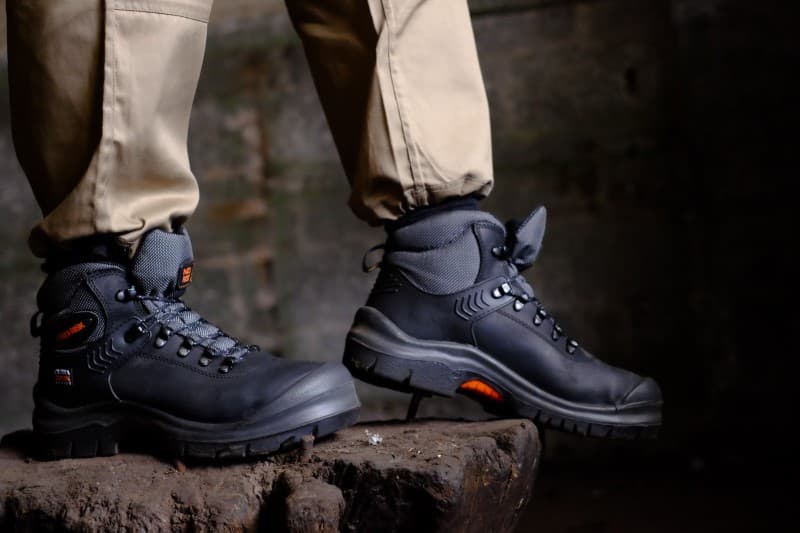 A pair of No Risk Blackrock High safety shoes on a rock