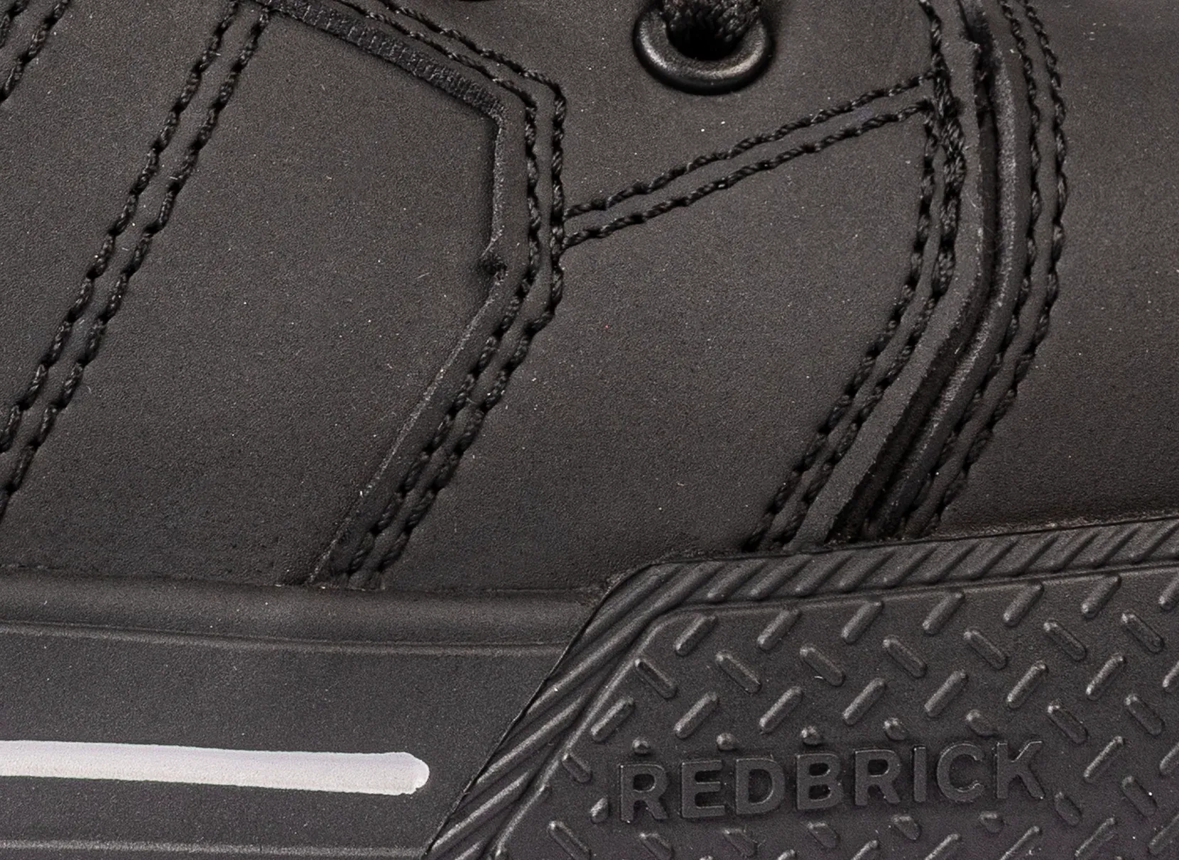 Close-up of the stitching of Red Brick Beater High