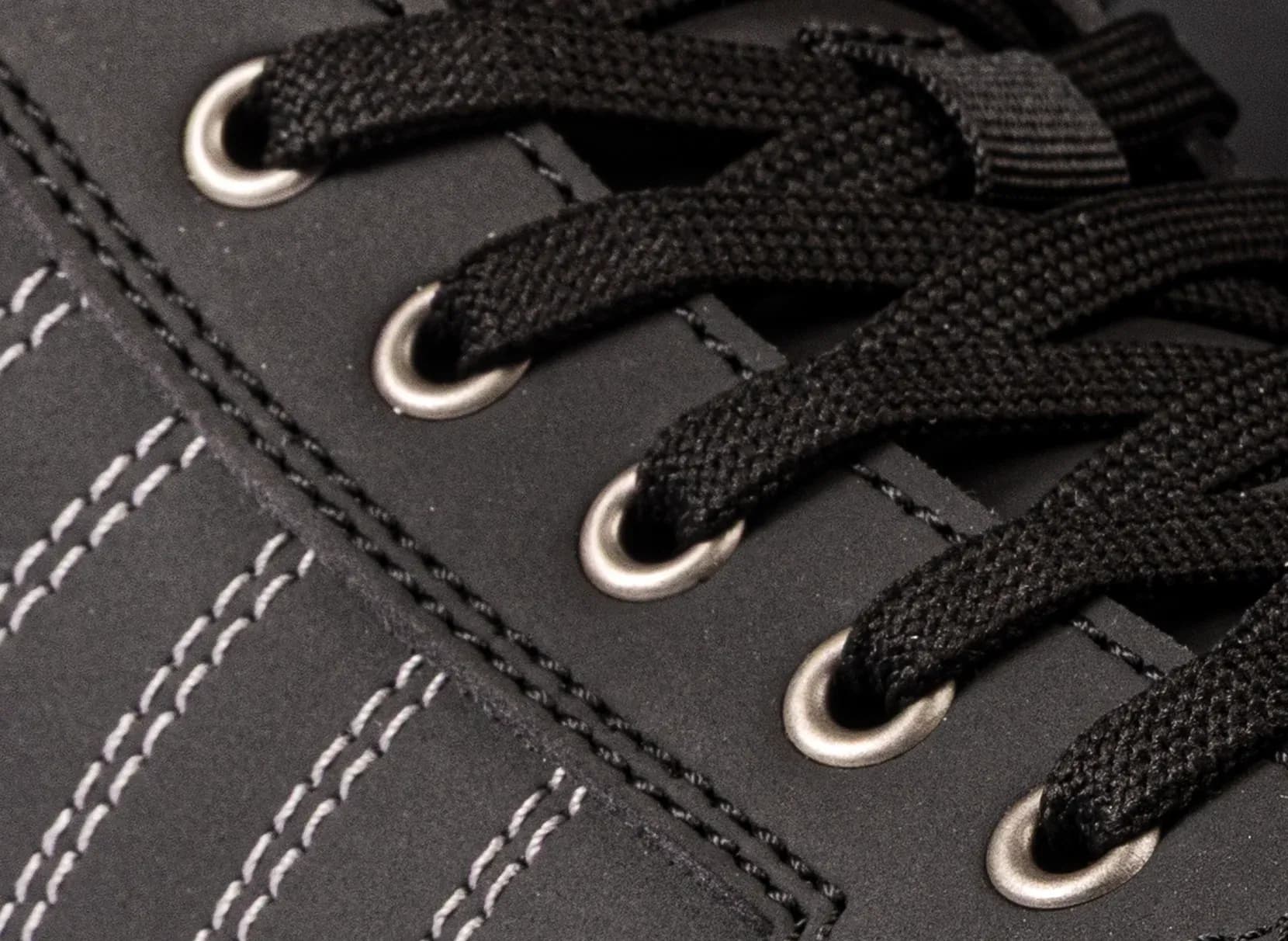 Close-up of the lacing rings on the Redbrick Champ High work shoe
